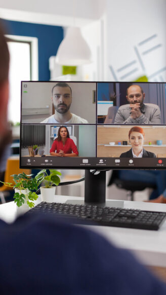 Businessman talking with remote team planning management strategy together during online videocall meeting conference in startup business company office. Teleconference call on computer screen